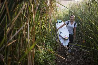 Carissa Moore enjoys the walk in the state park The tall reeds line the San Mateo Creek.