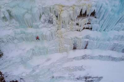 Climber Sasha DiGiulian climbs a wall of ice in Michigan's Upper Peninsula, USA.