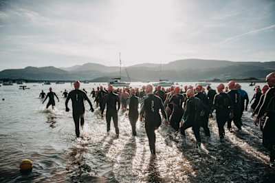 Swimmers prepare to take on the Hurly Burly at Barmouth beach