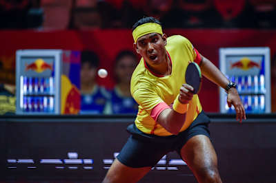Achanta Sharath Kamal plays a shot during a match at Ultimate Table Tennis