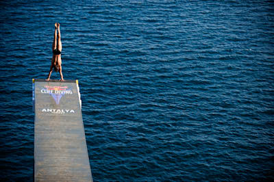 Oleg Vyschyvanov ready to drop into his dive from armstand in Antalya, Turkey during the 2009 Red Bull Cliff Diving World Series