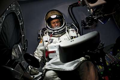 Felix Baumgartner of Austria sits in his capsule during the preparations