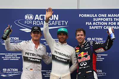Nico Rosberg, Lewis Hamilton ja Sebastian Vettel Malesian GP:n palkintopallilla 2014.