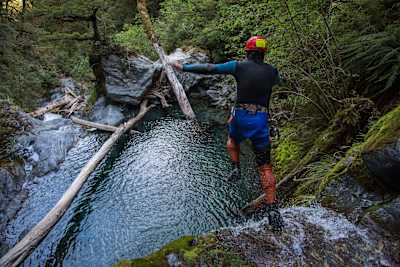 A Canyoner jumps into a water hole in a canyon in Wanaka, New Zealand.