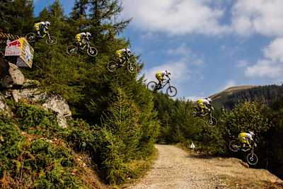 Gee Atherton road gap at Red Bull Hardline mountain bike event in Dyfi, Wales