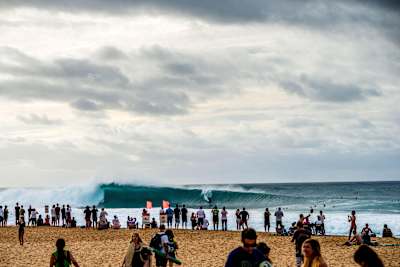 Australian surfer Julian Wilson drops in to the takeoff at Pipeline break on Hawaii's North shore