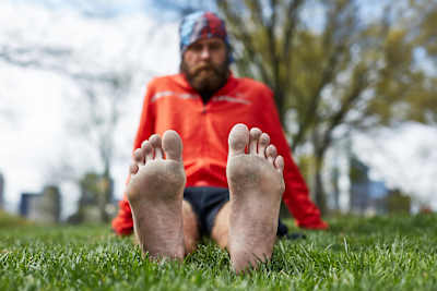 Trans-America runner Patrick Sweeney shows off his battered feet after his epic 114-day run across the country