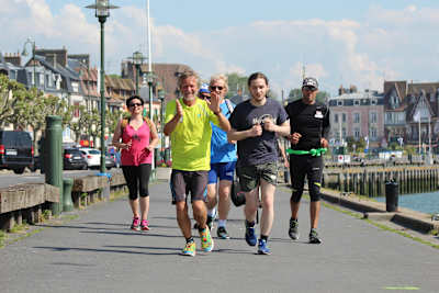 Patrick Malandain running with supporters in Deauville, France