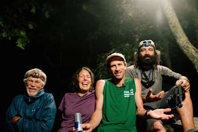 Karl Meltzer, celebrates with his family and crew chief after breaking the record for running the length of the Appalachian Trail on 18 September, 2016.