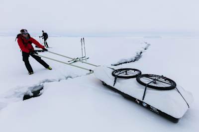 Stefan Glowacz pulls his sled across a crevasse.