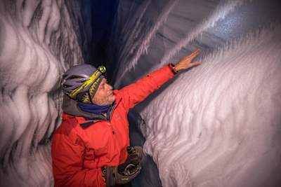 Professor Sharpe looks at the ice with both amazement and disbelief as he and Will Gadd explore the Athabasca Glacier