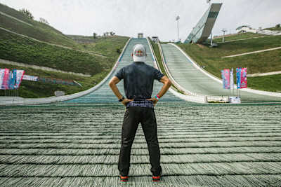 Red Bull 400 champion Ahmet Arslan in front of Kazakhstan’s modern ski jump.
