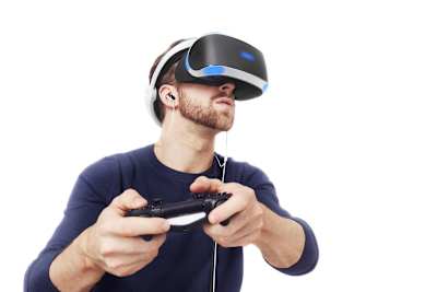 A man holding a controller and playing with Sony’s PlayStation VR