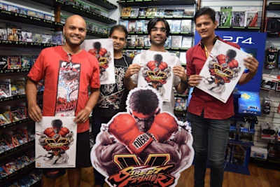 Devraj (centre right) at a Street Fighter 5 event. Devraj (centre right) at a Street Fighter 5 event.