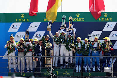 All smiles on the podium after 24 gruelling hours The top three teams celebrate on the podium at the 2017 Le Mans 24 Hours endurance race in Le Mans, France on June 17, 2017.