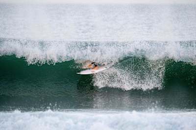 Jordy hides behind the curtain