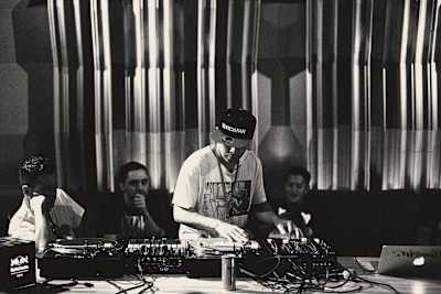Pioneering turntablist DJ Qbert drops the beat during a Red Bull 3Style workshop at the 2015 World Final in Tokyo, Japan.