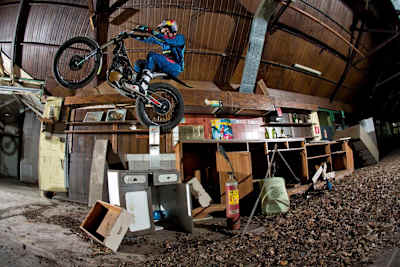 Dougie Lampkin rides his trials bike around an abandoned theme park in Milan, Italy
