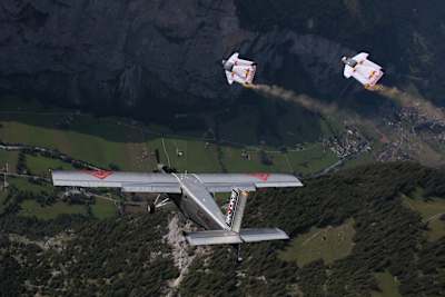 Fred Fugen and Vince Reffet BASE-jumping in Switzerland.