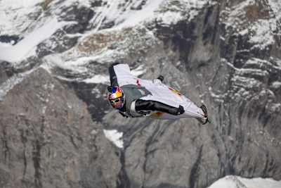 Fred Fugen flying above Swiss Mountains.