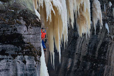 An image of climber Sasha DiGiulian climbing ice in Michigan, USA.