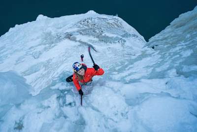 Sasha DiGiulian is pictured climbing up an ice structure in Michigan, USA.