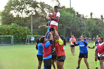 Each team lifts a player high to receive the ball during a line-out