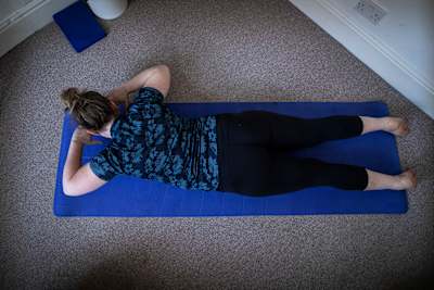 Rotate to one side from the waist, arms parallel to the floor.