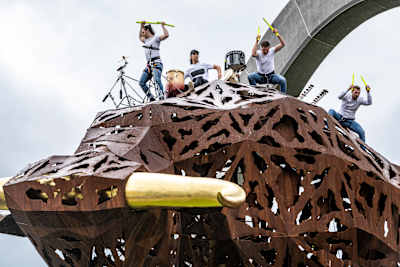 Percussionists play the bull sculpture at the Red Bull Ring in Spielberg, Austria on June 22, 2020.