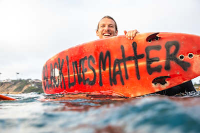 Participant shows his surfboard