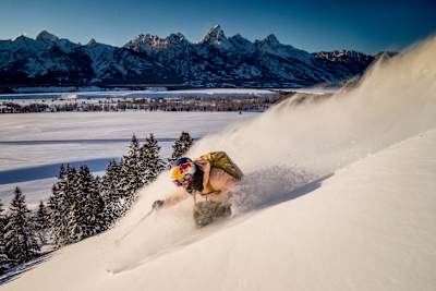 Michelle Parker flanks a turn in front of the Tetons in Jackson, Wyoming, USA on 7 February, 2019.