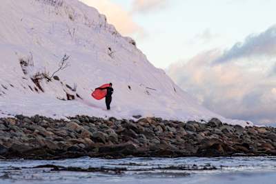 Jill Manos Walking the beach post surf In Lawrencetown, Nova Scotia, Canada on December 09, 2021