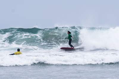 Danielle Black Lyons, Roxy team rider and resident of San Diego, CA., does a bottom turn on an overhead set.