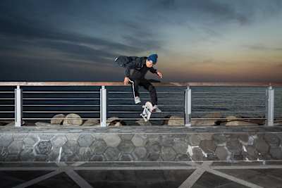 Jason Choi performs a Tre Flip