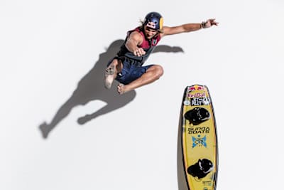 Cory Teunissen catching air in front of a white wall