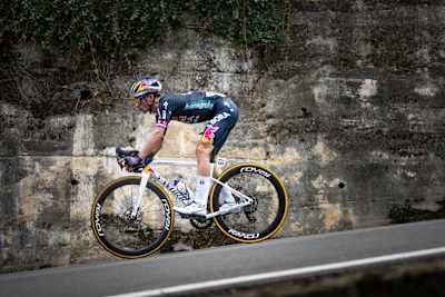 In 2024, Primož Roglič of Red Bull BORA-hansgrohe team races downhill at La Vuelta cycling event in Spain.