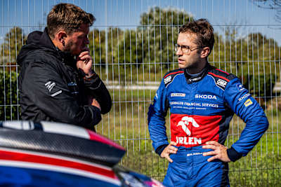 Engineer Marcis Kenavs talks set-up with Marczyk