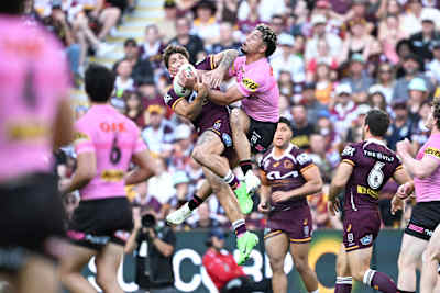 Reece Walsh and Izack Tago meet in the air