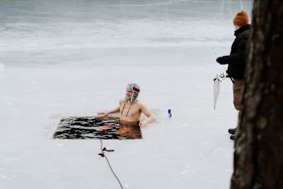 Karsten Warholm takes an ice bath on a frozen lake close to Oslo, in his home country Norway