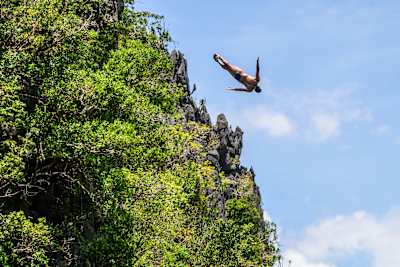 Jonathan Paredes of Mexico executes a perfect dive from a 24.5-metre pinnacle during the Red Bull Cliff Diving World Series opener in El Nido, Philippines, in April 2025