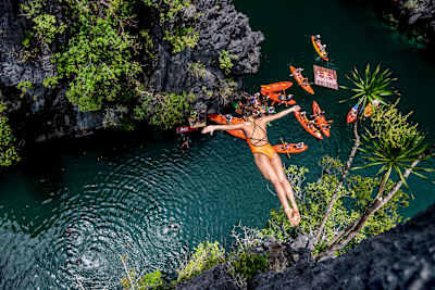 Nelli Chukanivska showcases her skills during the 2025 Red Bull Cliff Diving World Series in El Nido, Philippines, leaping from a 20m pinnacle into the Small Lagoon