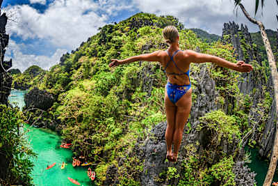 Rhiannan Iffland executes a breathtaking 20m dive during the 2025 Red Bull Cliff Diving World Series in El Nido's stunning Small Lagoon