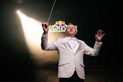 Adam Howard conducting magnificently during the Red Bull Symphonic event in Johannesburg, South Africa, on March 26, 2025, showcasing a fusion of classical and modern music artistry