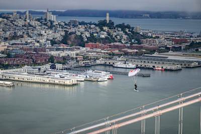 Sean MacCormac skysurfing over the San Francisco Bay Bridge