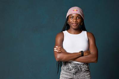 Thati Zulu stands confidently at Red Bull Base in Elsbethen, Austria during a 2025 portrait session, representing Red Bull's dynamic energy and bold spirit