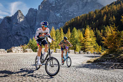 Professional cyclist Primož Roglič and Red Bull Goni Pony record holder Luka Kovačič cycling on Vršič road.