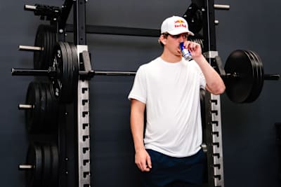 Arch Manning recharging in between sets with Red Bull Energy Drink