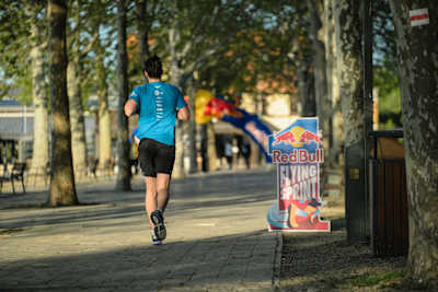 A competitor races at the Red Bull Flying Sprint during Ultra Balaton in Balatonfüred, Hungary, on April 26, 2026, showcasing Red Bull’s adventurous spirit at Hungary’s iconic running event