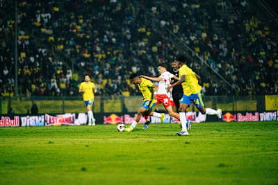 Exciting 2025-2026 friendly clash between RB Leipzig and Mamelodi Sundowns in Pretoria, South Africa, with Red Bull branding energising the stadium atmosphere