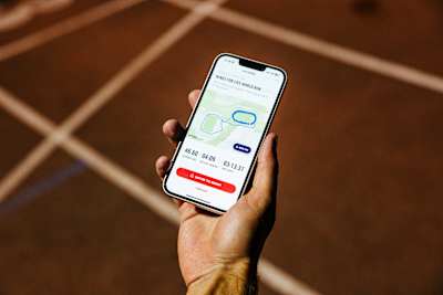 Participant uses the mobile app during the Wings For Life World Run 
